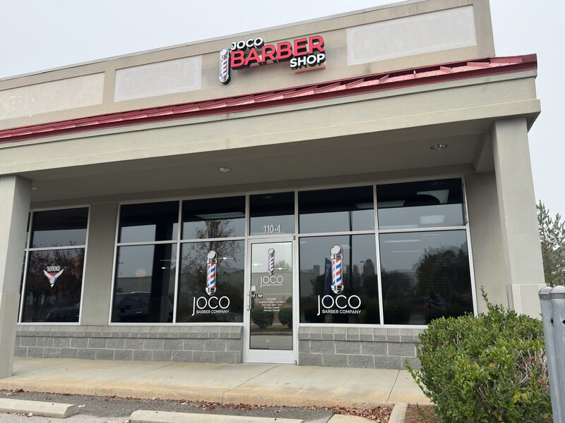 The red awning over the shop front at 110 Bratton Drive.